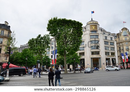 Paris, France - May 14, 2015: Tourists Shopping at Louis Vuitton store on May 14, 2015 in Paris, France. This store offers a wide range of luxury Louis Vuitton clothes and accessories