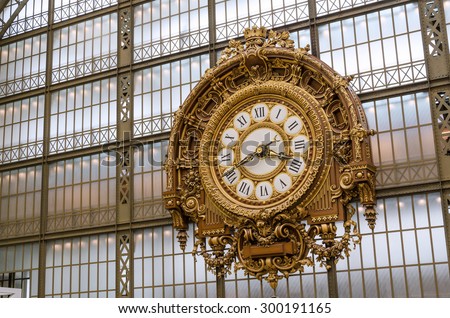 Paris, France - May 14, 2015: Large Golden clock in Museum d\'Orsay.The museum houses the largest collection of impressionist and post-impressionist masterpieces in the world.