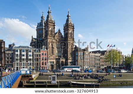 Amsterdam, Netherlands - May 8, 2015: Tourists at Church of Saint Nicholas(Basilica of Saint Nicholas) on May 8, 2015 in Amsterdam, Netherlands.The basilica has a collection of religious murals.