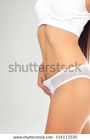 Beautiful female body in white underwear