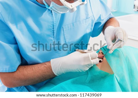 Dentists operate on a tooth