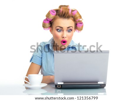 Funny business woman looking surprised or astonished while using the laptop, isolated on white