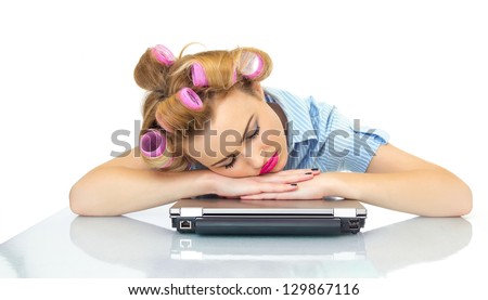 Tired business woman sleeping on her workspace or laptop. Isolated on white