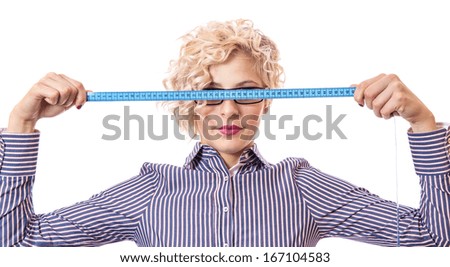 Young businesswoman with measurnig tape, isolated on white background. Worried female using measure tape -  measurement