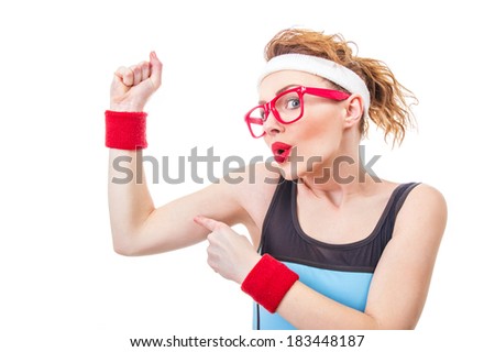 Funny fitness woman pointing on her biceps, isolate on white