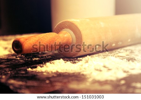 Rolling pin and flour on the kitchen table