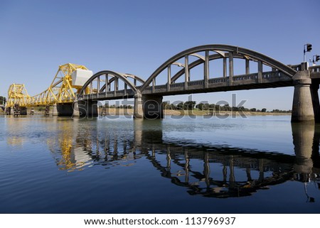 Rural yellow, raising cantilever bridge, Sacramento River, California, USA