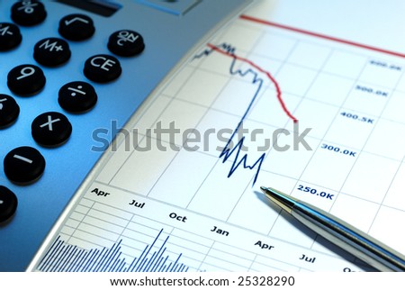 Financial chart, market\'s falling, calculator, pen, cross key lighting with blue gel left