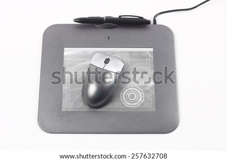 Computer drawing tablet with pen. Isolated on white