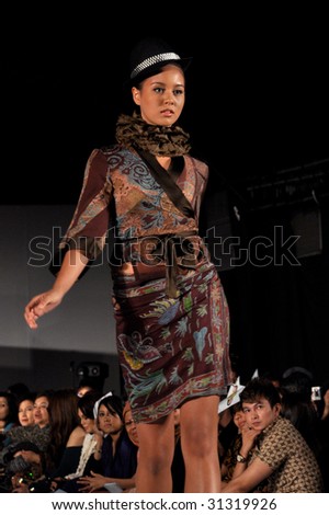 KUALA LUMPUR, MALAYSIA-APRIL 2:Model displays creation by Tom Abang Saufi during STYLO Fashion Show April 2, 2009 in Kuala Lumpur.The fashion show was held in conjunction with Malaysian F1 Grand Prix