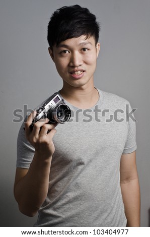 Asian guy with his vintage camera
