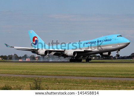 AMSTERDAM - JULY 04: Korean Air Cargo Boeing 747 lands at AMS Airport in Netherlands on July 04, 2012. Korean Air is the flag carrier and the largest airline of South Korea.