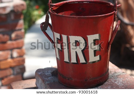 fire bucket on brick wall