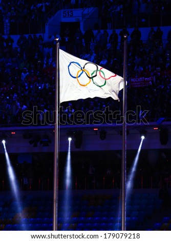 Sochi, RUSSIA - February 23, 2014: Olympic flag at closing ceremony in Fisht Olympic Stadium at the Sochi 2014 Olympic Games