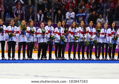 Sochi, RUSSIA - February 20, 2014: Suisse Women\'s Ice hockey team bronze medalists, at medal ceremony after Gold Medal Game at the Sochi 2014 Olympic Games