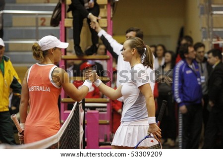 KHARKIV, UKRAINE - APRIL 24: Ukrainian tennis player Mariya Koryttseva (R) shake hand her opponent at Fed Cup, 2010 match Australian - Samantha Stosur (L), April 24, 2010 in Kharkiv, Ukraine