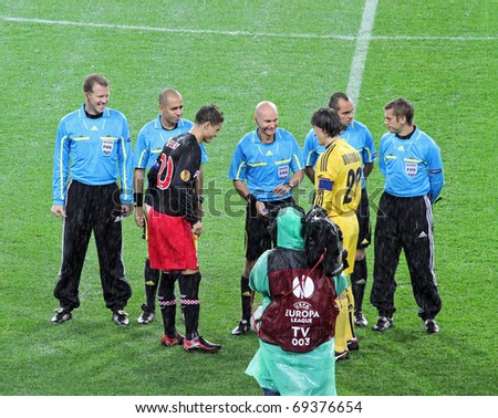 KHARKIV, UA - SEPTEMBER 30: Coin toss at start  of Metalist Kharkiv vs. PSV Eindhoven Group stage UEFA Europe League football match (0:2), September 30, 2010 in Kharkov, Ukraine