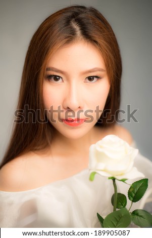 Beautiful girl and white rose , beautiful face asia girl, south east asian