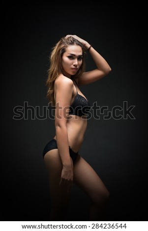 south east asian sexy girl wear black bikini , dark style