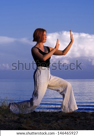 Young woman doing yoga outside