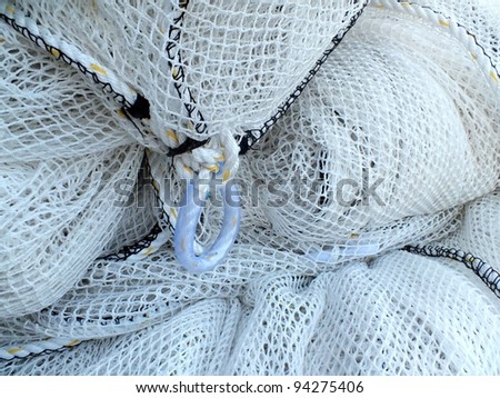 Bundle of white netting for fishing boats.