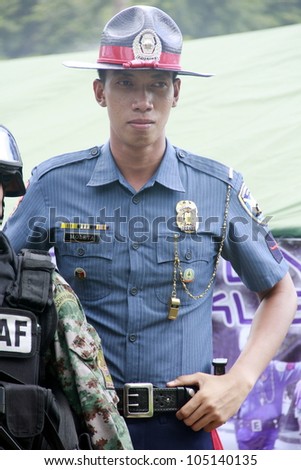 MANILA - JUNE 12: Police Officer on his post in the event location at The Philippines Independence day on June 12, 2012  in Manila. The Philippines celebrate the 114th Independence Day.