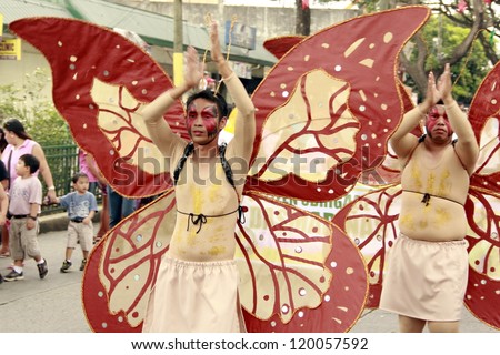 CAVITE, PHILIPPINES - NOV. 26: Government employees participate in the 2nd Paru-paro Festival on November 26, 2012 in Dasmarinas City, Cavite. Celebrate butterfly festival with dance competition.