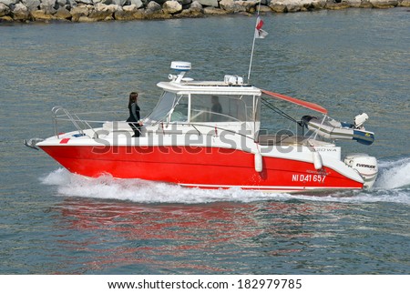 NICE, FRANCE - MAY 4: Escort boat for escorting ships in Port de Nice on May 4, 2013 in Nice, France. An escort boat is compulsory in port for all the cruising ships.