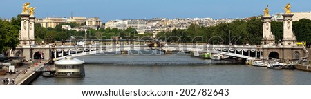 Panoramic view to Bridge of Alexandre III, Paris, France. The bridge, with its Art Nouveau lamps, cherubs, nymphs and winged horses at either end, was built between 1896 and 1900.