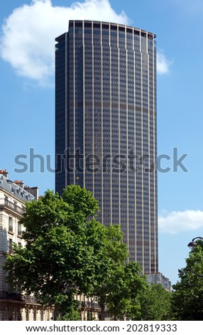 PARIS - JUNE 11: Tour Montparnasse (constructed 1969 - 1972) 210m, 59 floors office skyscraper on June 11, 2014 in Paris, France. Architects: Eugene Beaudouin, Urbain Cassan and Louis Hoym de Marien.