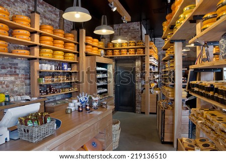 AMSTERDAM, NETHERLANDS - MAY 30: Whole Dutch cheeses fill the shelves of a specialist cheese shop on May 30, 2014 in Amsterdam, Netherlands. Danish cheese is very popular in the Netherlands.