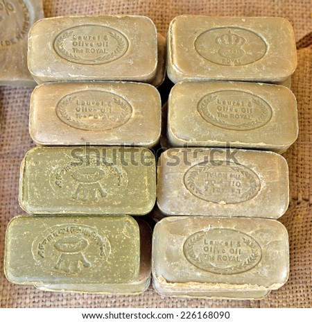 NICE, FRANCE - JUNE 8, 2014: Different flavored bars of soap from Marseille on a farmer\'s market.