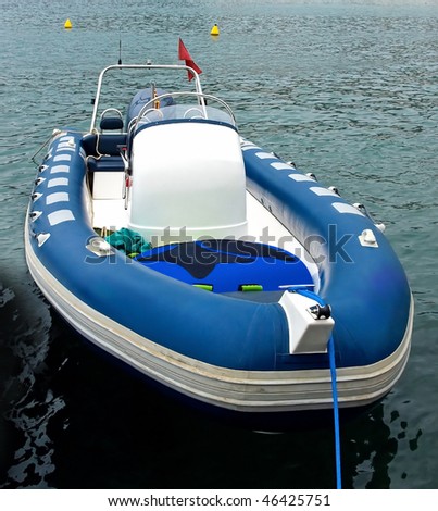 Blue motor inflatable boat in Spain.