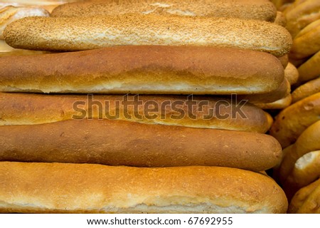 Lot of freshly baked french bread with crispy crust