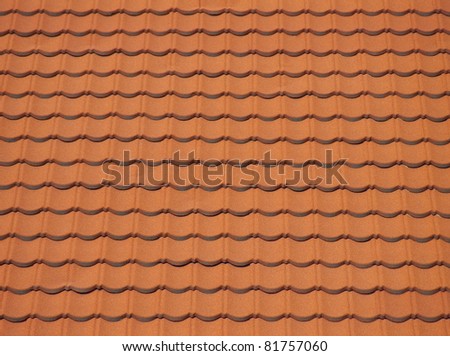 Red clean roof tiles background texture in regular rows.