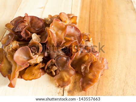 Black fungus or tree ear mushroom on wood background