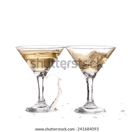 two wine swirling in a goblet martini glass, isolated on a white background