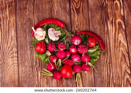 Heart symbol. diet concept. Healthy eating concept / food photography of heart made from different vegetables on wooden table