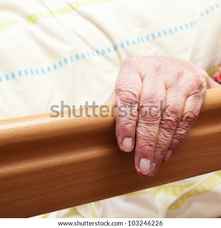 Care-dependent person lying in bed.