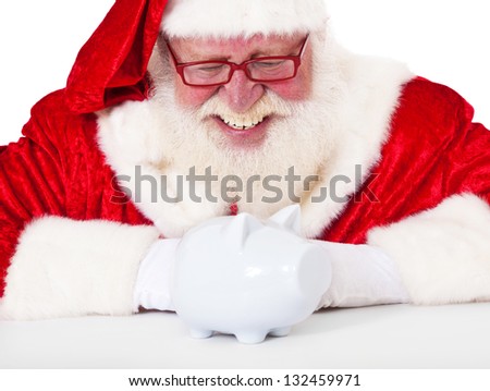 Santa Claus in authentic look with piggy bank. All on white background.