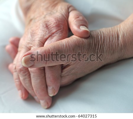 Old wrinkled hands of an elderly person.