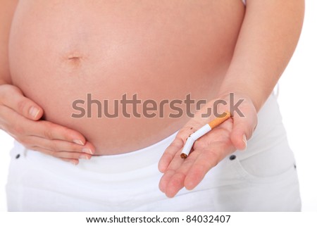 Pregnant woman quits smoking during pregnancy. All on white background.