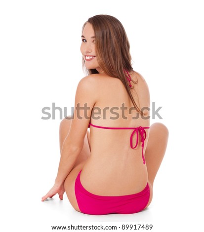 Rear view of an attractive young woman in bikini. All on white background.