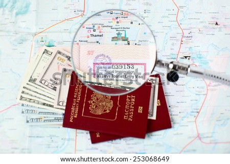 Russian passports and Kathmandu city map - focus on open tourist visa and Thamel - centre of the tourist industry in Kathmandu