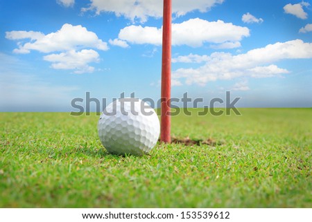 Golf equipment, golf ball with tee on course
