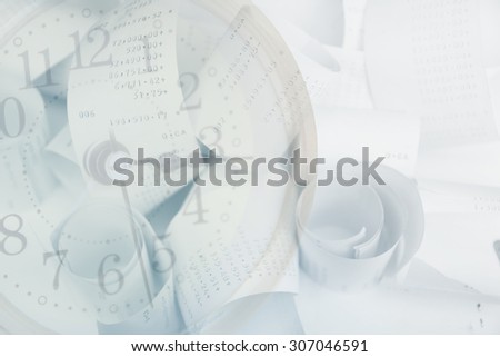 Paper cash register receipts in a lose pile close up with soft focus