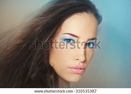 beautiful fantasy woman with blue eyes and makeup