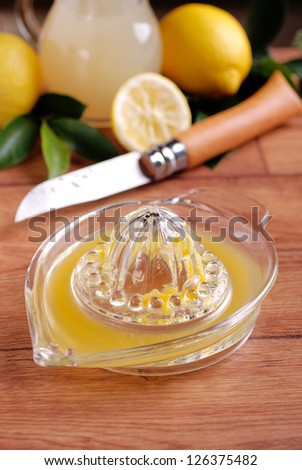 lemon juice with squeezer on the table