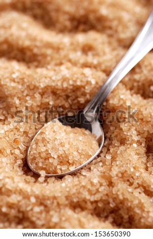 brown sugar in silver spoon