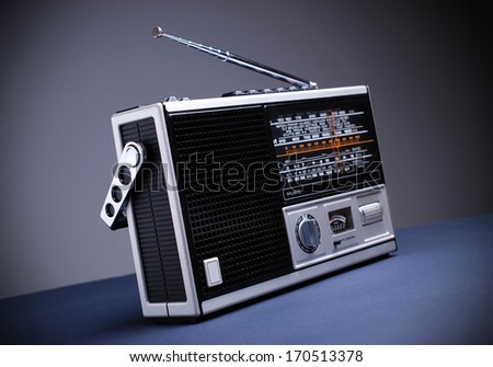 retro radio isolated on black table and gray background